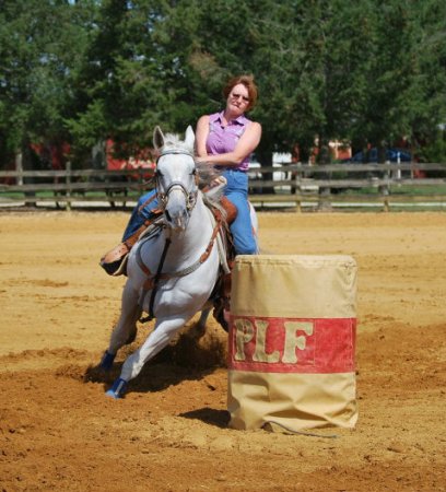 This is Chic. I only ran this mare for about a year and half (she had many soundness issues) I loved this mare and was just starting to clock in the 1D when I had to retire her. It broke my heart. A lot of hopes and dreams were lost when I had to quit running her. I love this pic of her. I was a little thinner in this pic. I can't fit in that shirt anymore!! 